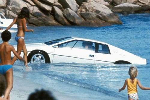 car emerging on beach