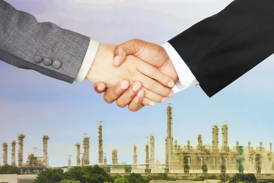 Hands Shake Above Oil Refinery